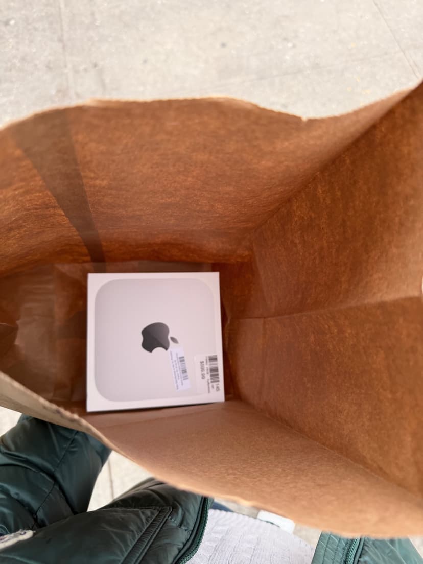 Mac Mini box in a Microcenter bag